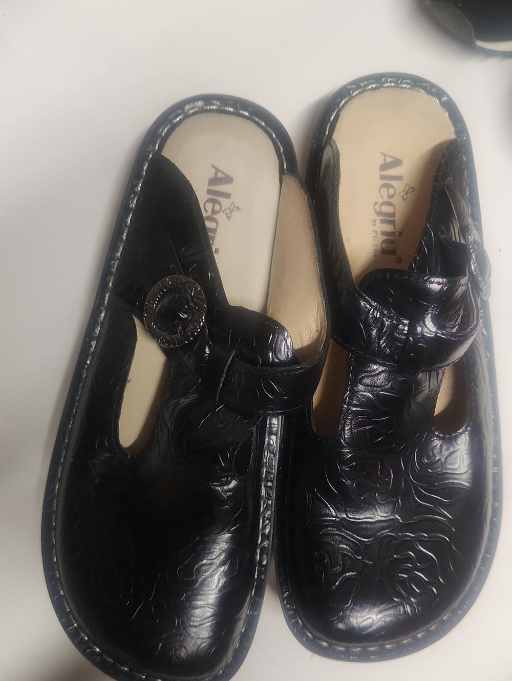 Alegria Black Embossed Floral Slip-On Clogs